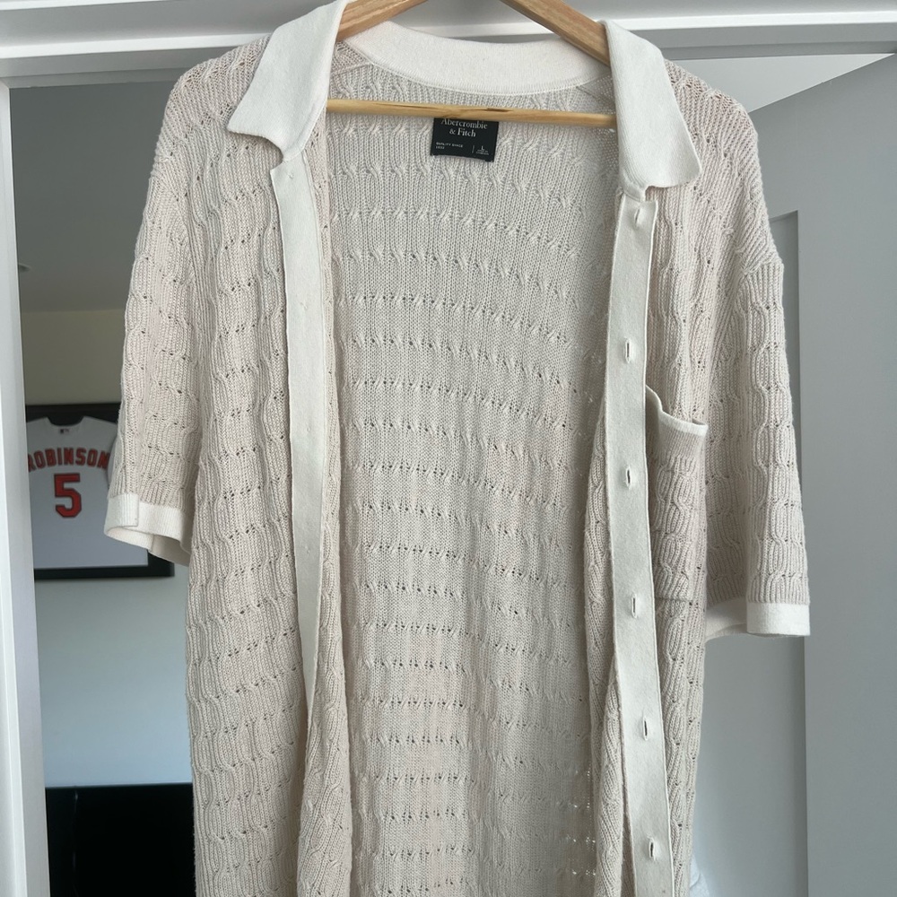 Crochet style stitch button through sweater polo